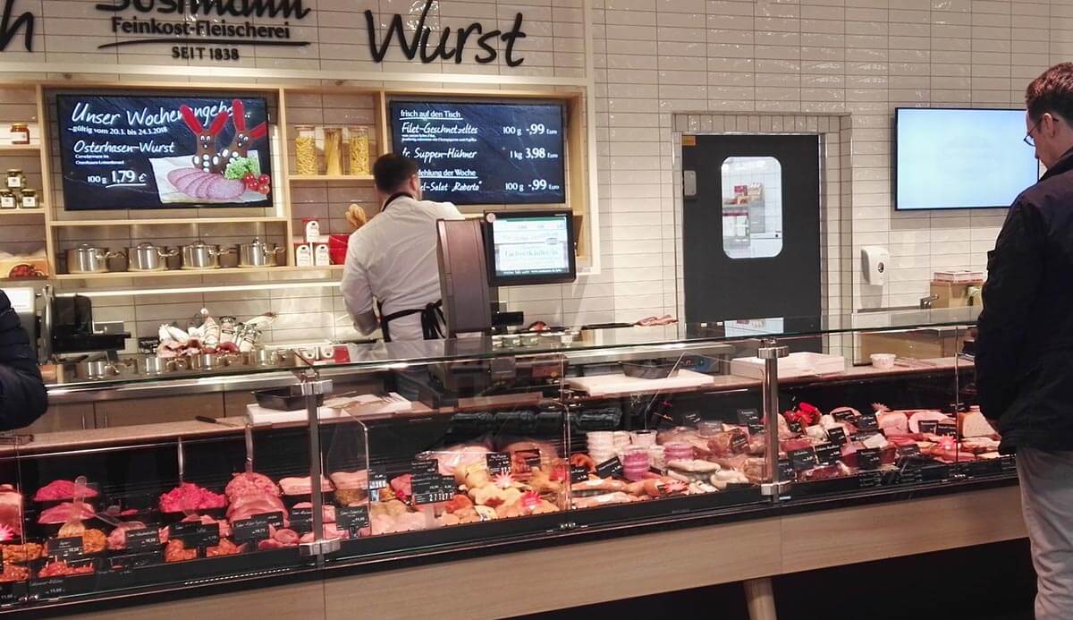 Supermarket swing door behind meat counter